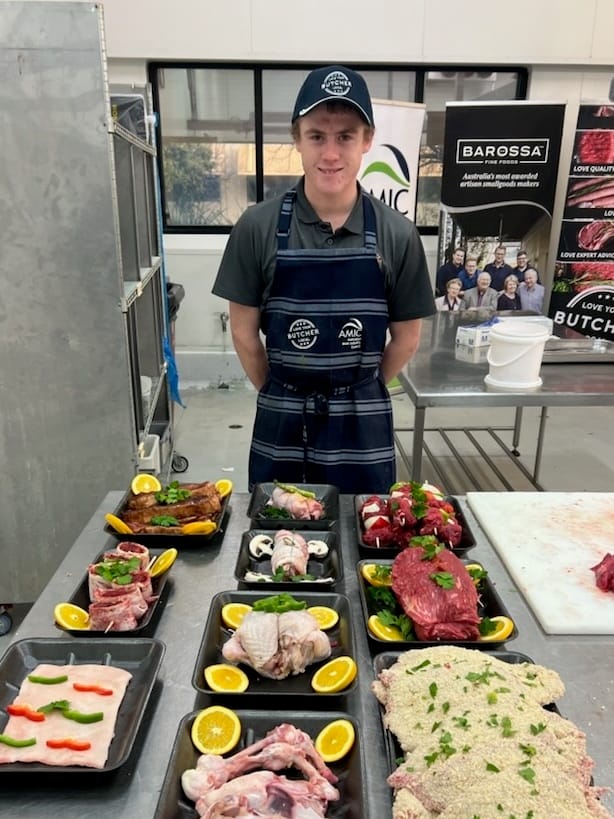 Butcher apprentice carving his place
