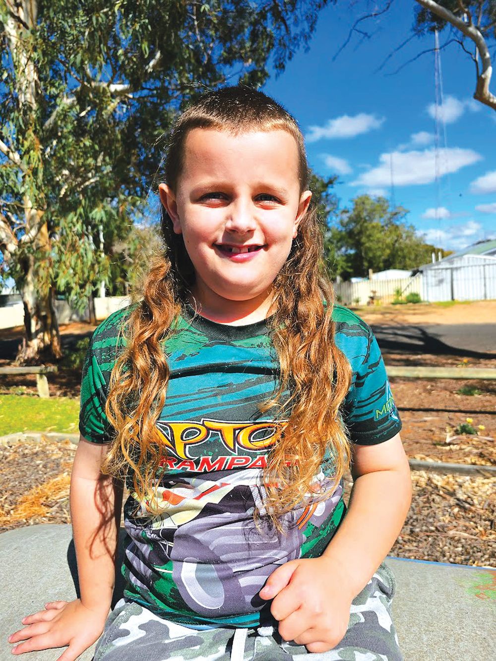 Jedrik preparing his locks to win Mulletfest post image