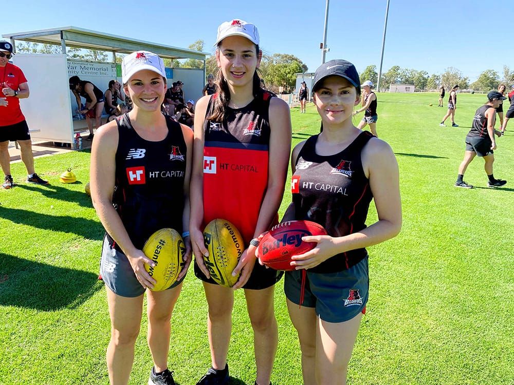 Local girls tackle footy post image