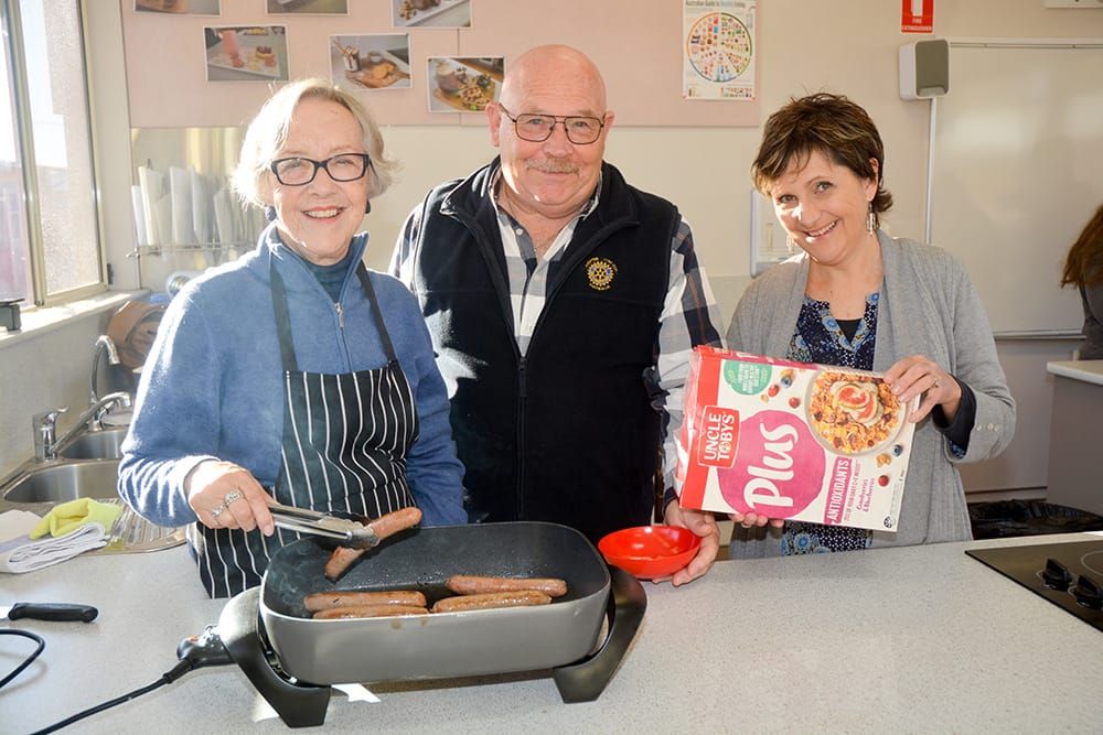 Volunteers help students start off their day right post image