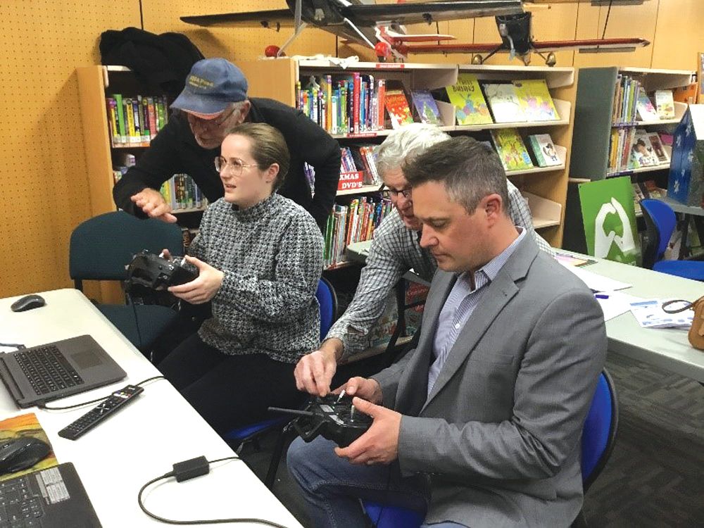 Council duo takes flight in library post image