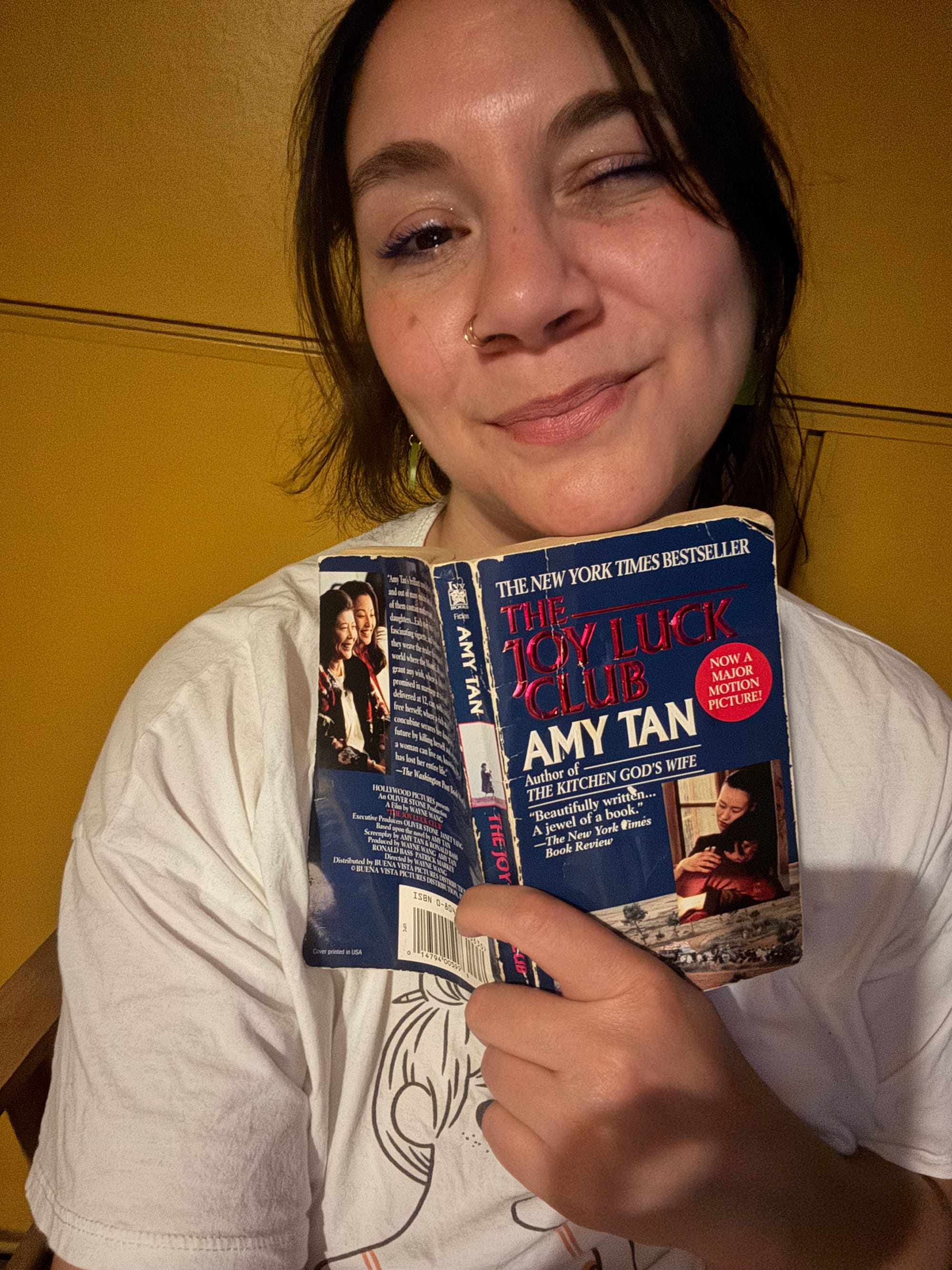 Me holding The Joy Luck Club by Amy Tan