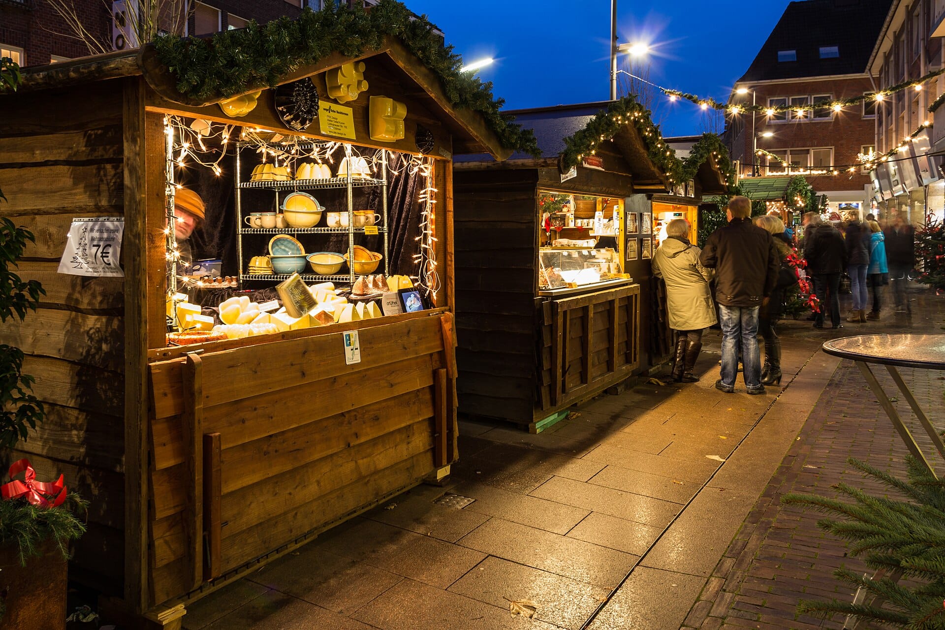 Christmas market stalls lit at night