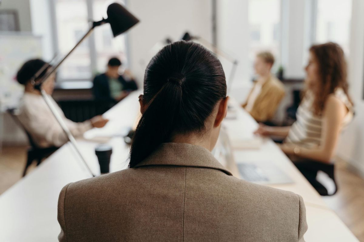 Professional woman with a view of her team in the office.