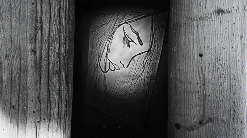 A black-and-white sketch of a sad woman’s face is partially visible through a narrow gap between wooden planks.