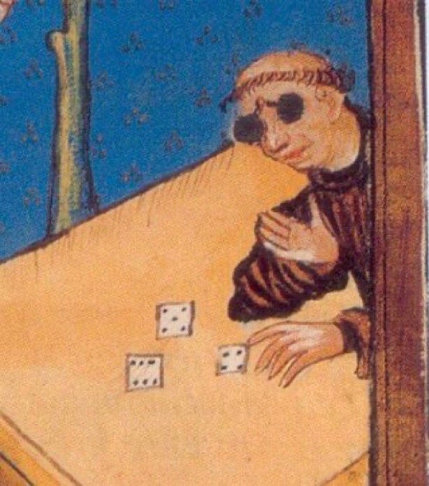 Cropped image of a medieval manuscript illustration showing a monk gambling. The monk's body is mostly obscured by a frame from the right, so we see only his head and hands. He is wearing dark glasses that pinch to his nose with a hinge in the center and has tonsured hair.. He has rolled a 6, 5, 4 on three square dice on the table in front of him. The background is a brilliant lapis lazuli blue with ochre dots and is broken by the trunk of a tree with some shading. 