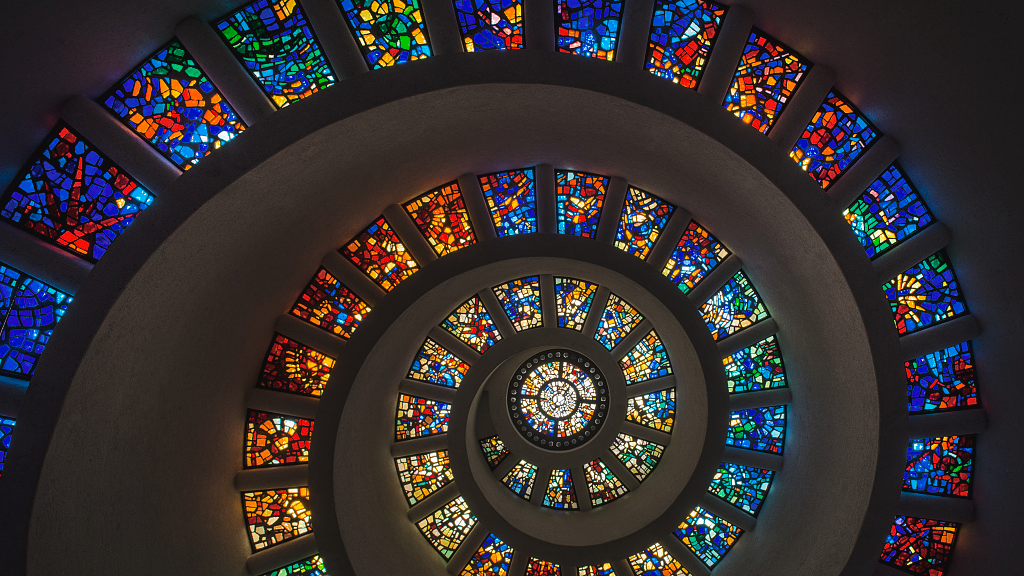 A stained glass spiral, looks generated but its part of a real building in Dallas Texas. 
