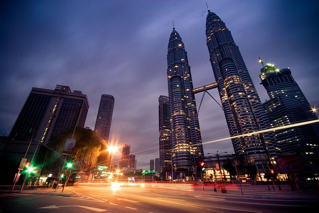 HomeExchange is the social network that makes travelling for free easy GuestToGuest, home exchange, sharing economy, beautiful places at night, petronas towers kuala lumpar