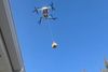 Still from video by Deirdre O'Neill of a drone delivery next door.
