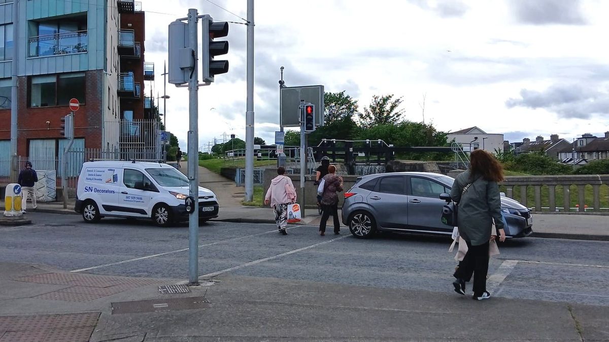 Frustrated by longer wait for green man at Blackhorse junction, people dash across in front of moving cars