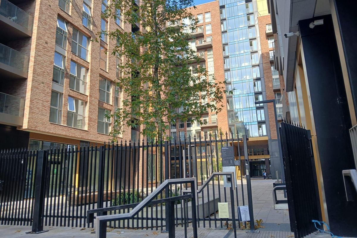 Keep fences and gates around Liberties apartment complex for now, council tells owner