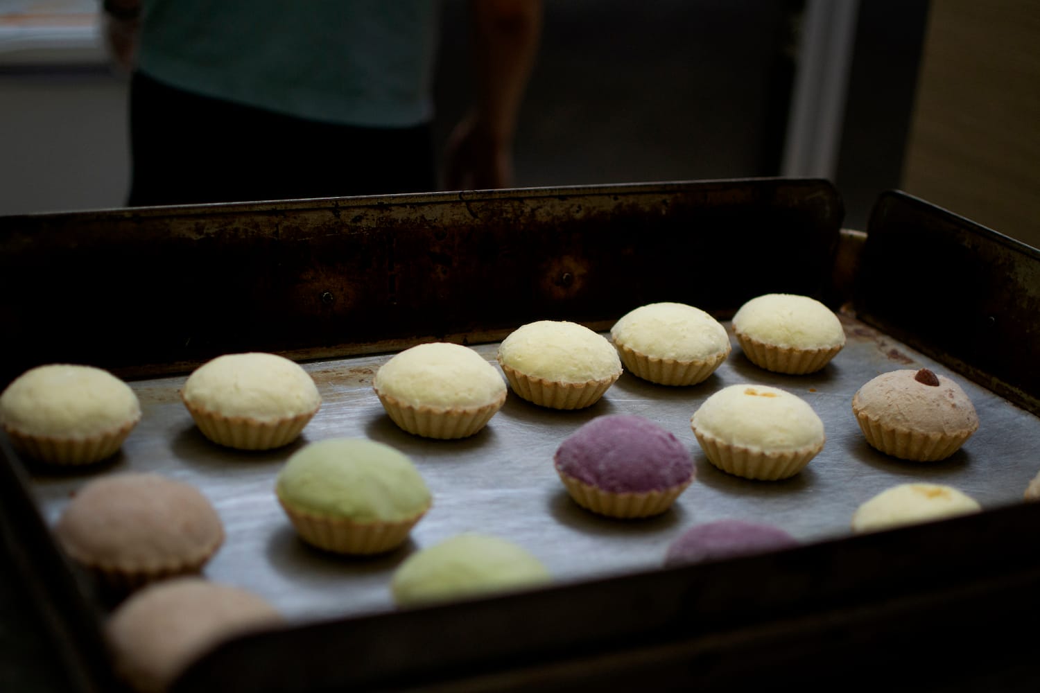 A tray of colourful small tarts.