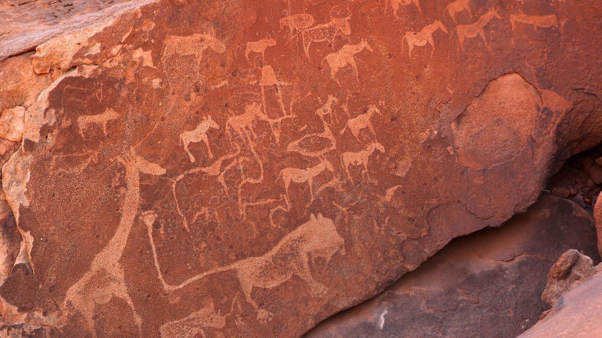 Ancient rock engravings at Twyfelfontein in Damaraland, carved into red sandstone