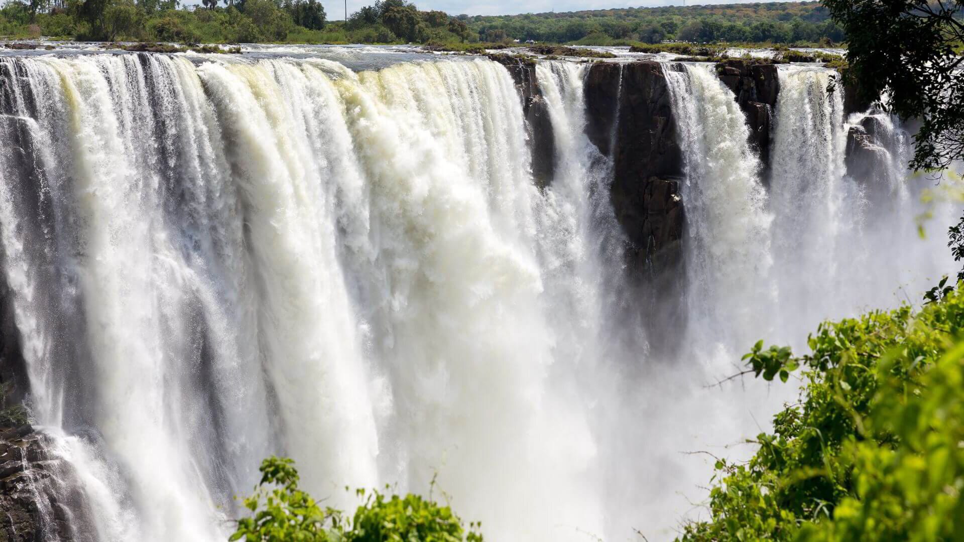 Victoria Falls viewed from the Zambian side with mist rising from the gorge