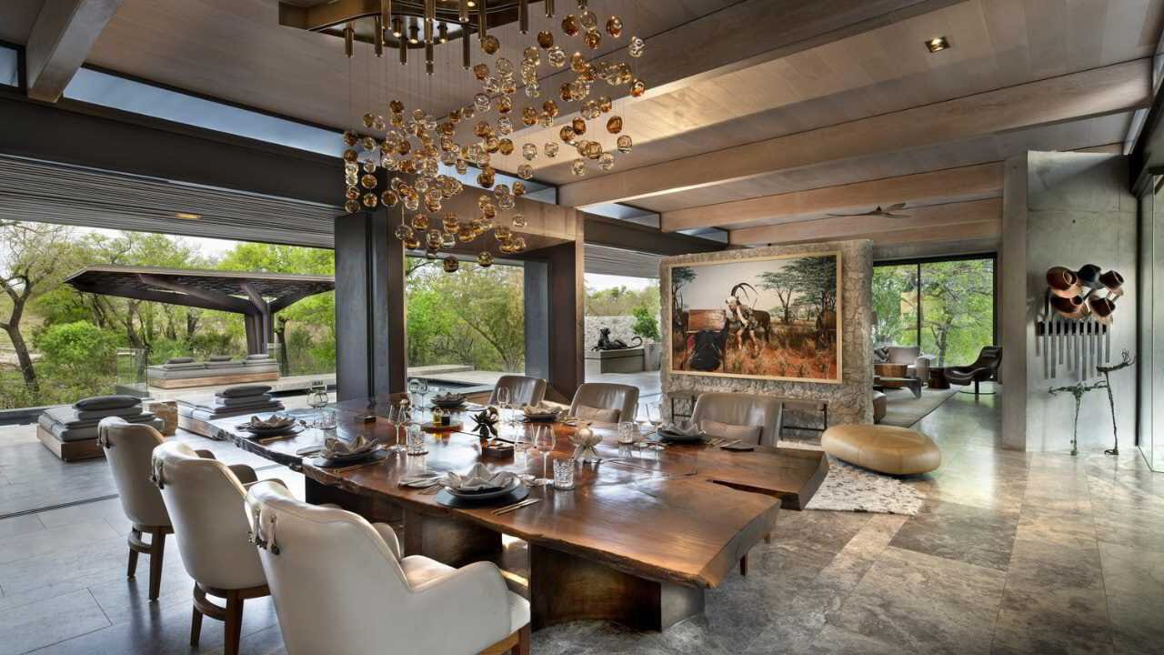 Dining room inside a private safari villa, set for a family meal.