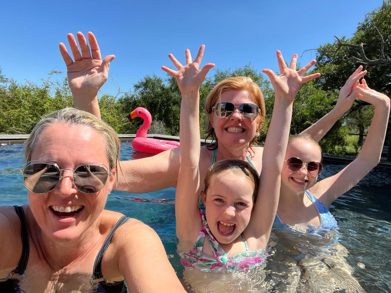 Vikki and Sian in the lodge pool with one of our families, the recovery half of a family safari day