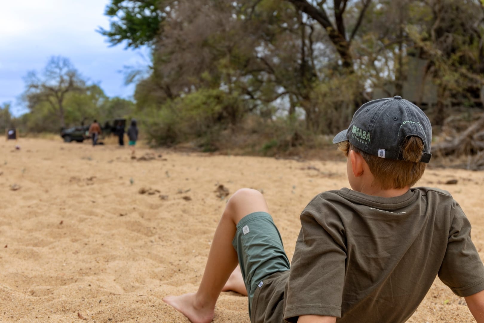 A young guest in a quiet moment in the bush, the kind the trip is really about