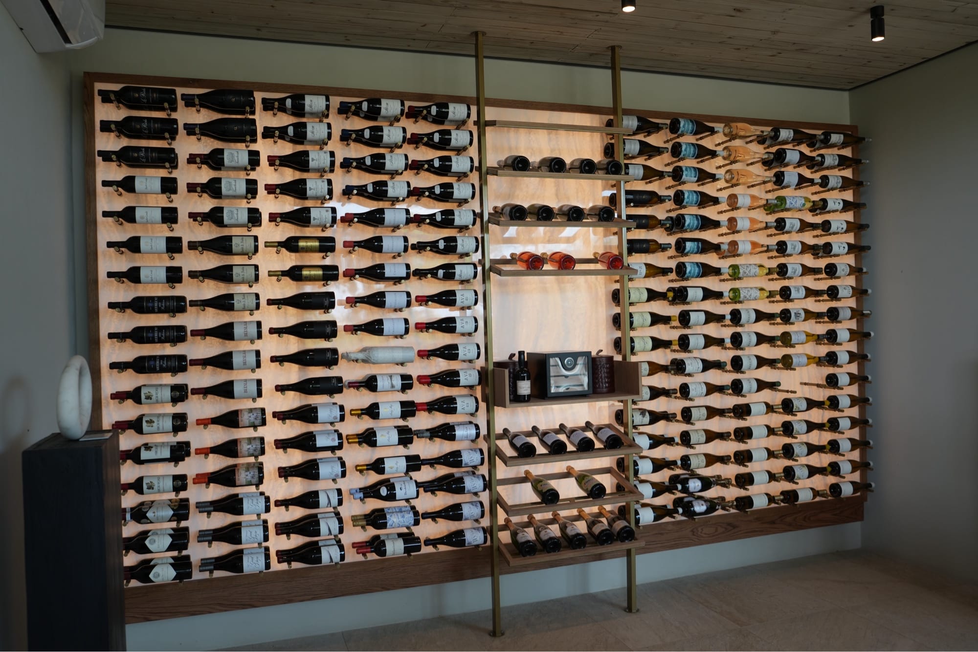 Floor-to-ceiling backlit wine wall at Lion Sands Ivory Lodge