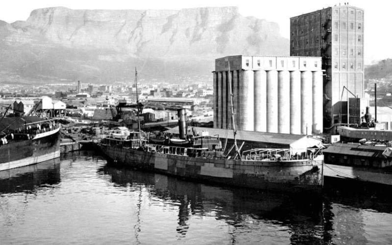 The Silo Hotel interior showing a boldly furnished suite with high ceilings and panoramic windows overlooking Table Bay