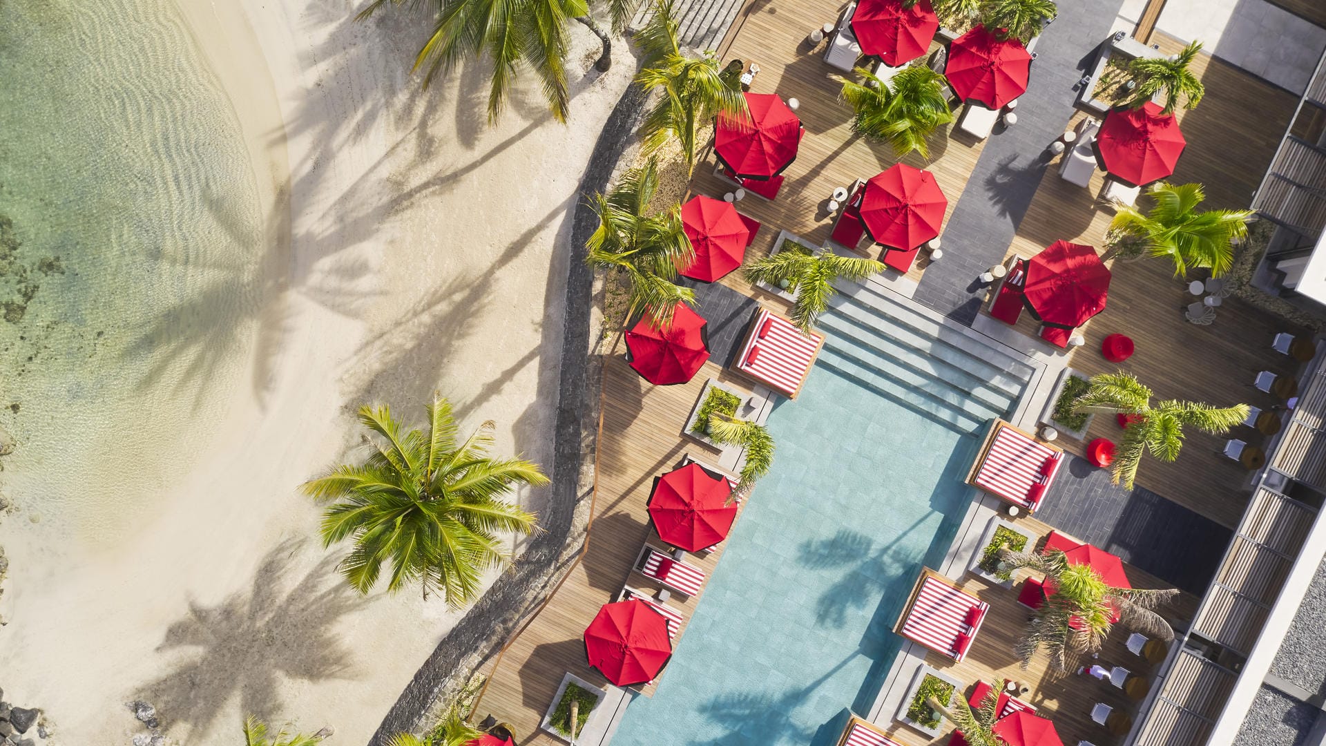 The beach and pool deck at LUX* Grand Baie on the north coast of Mauritius, the ten-night island finish