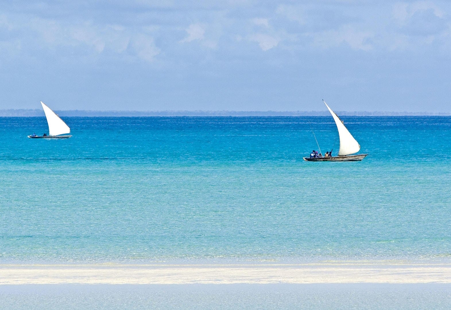 Two dhows on turquoise water with white sandbank, Bazaruto Archipelago, Mozambique