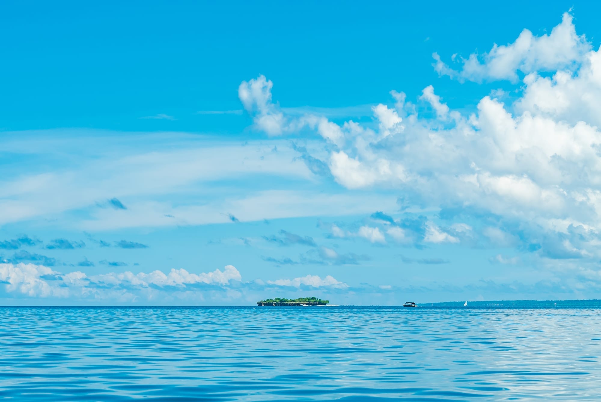 Aerial of Mnemba Island, a 1.5 kilometre coral atoll ringed by turquoise water off Zanzibar's north-east coast