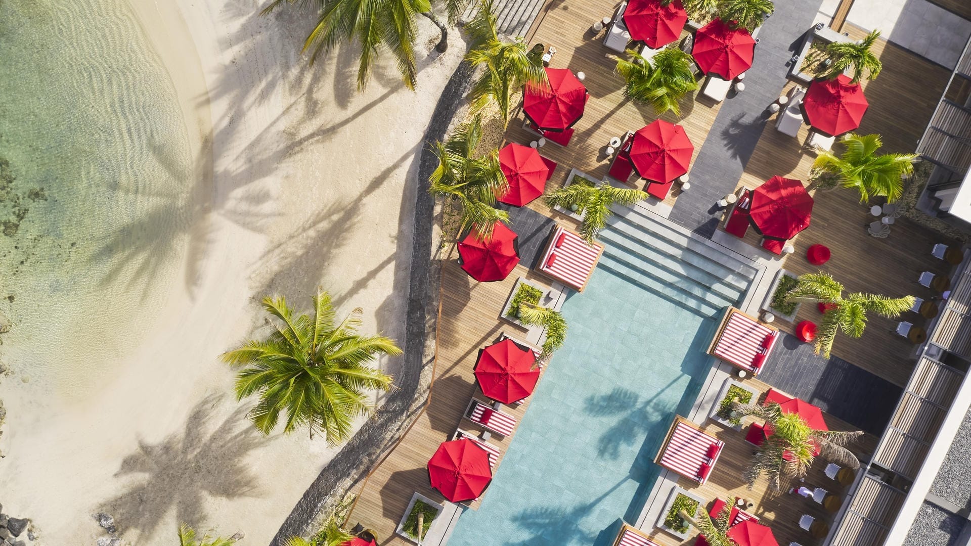 Beach and pool deck on the north coast of Mauritius at golden hour, the ten-night island finish