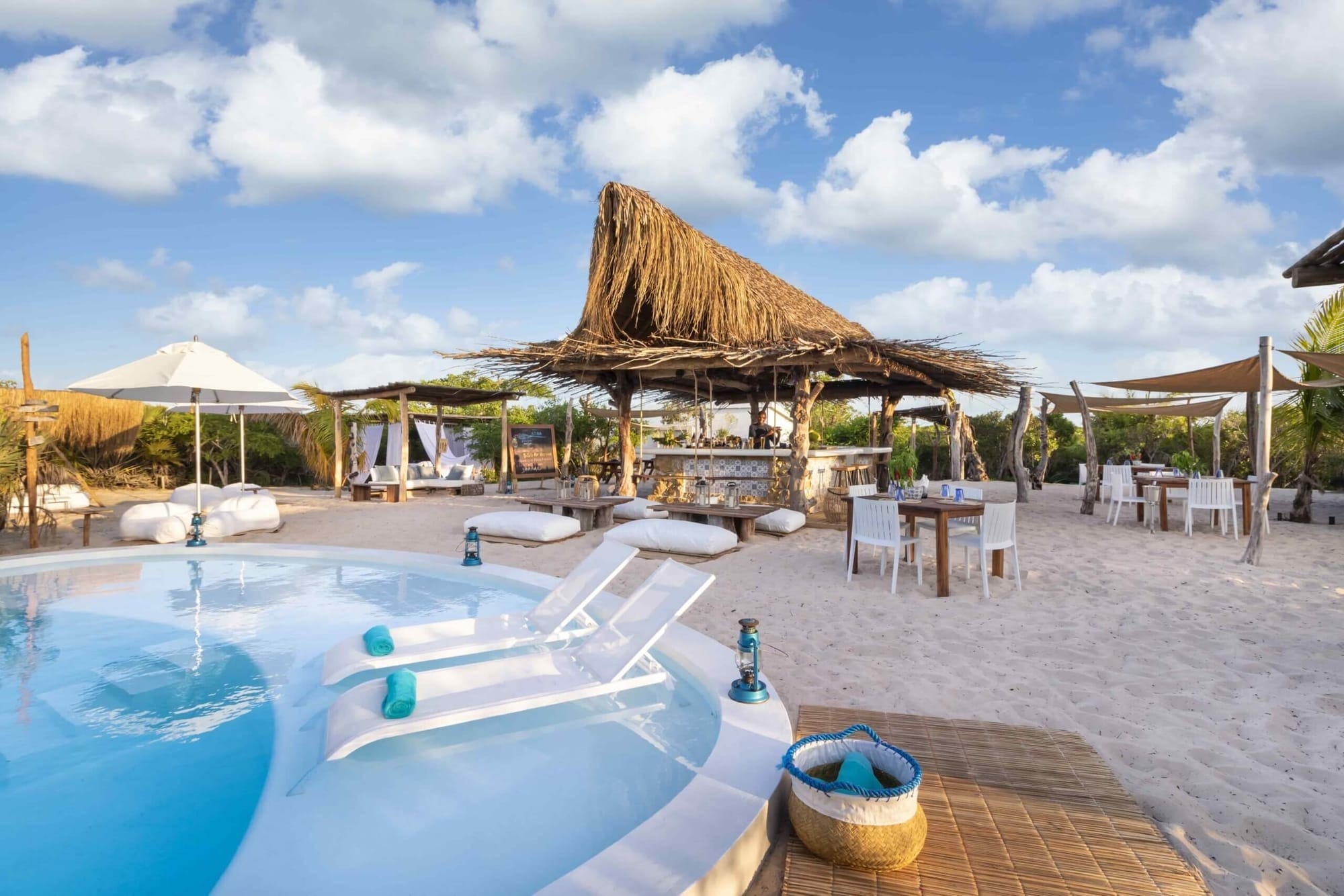 Private island lodge architecture and palms, Bazaruto Archipelago, Mozambique