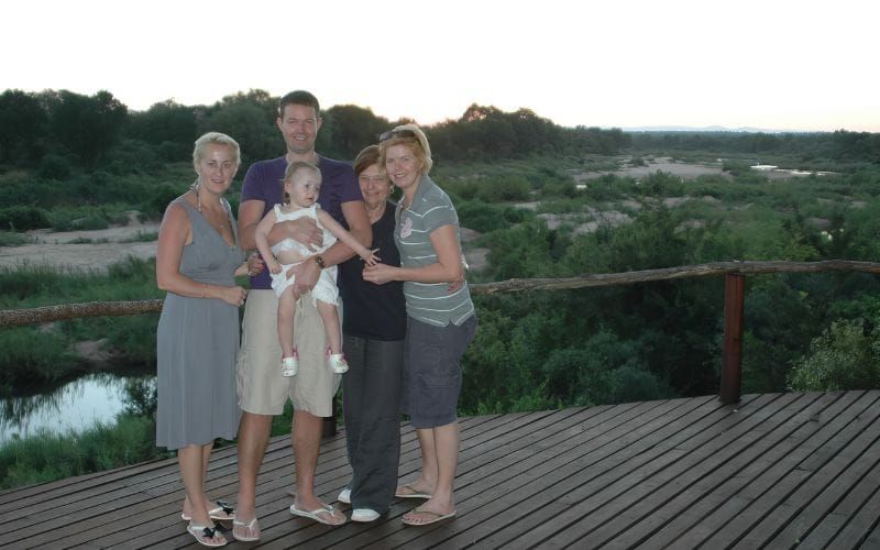 A family watching elephant on a game drive at golden hour in the South African bush