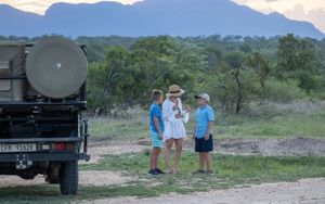 A family stops for sundowners on their safari