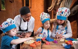 Kids enjoying cooking activities with a safari lodge chef