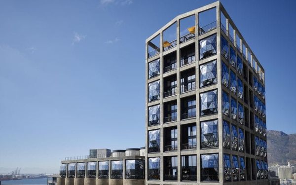 The Silo Hotel exterior on Cape Town's V&A Waterfront, its bulging pillowed glass windows catching the late afternoon light