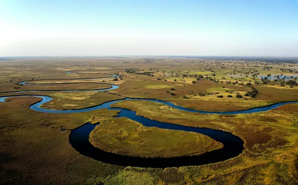 Mokoro gliding through the channels of the Okavango Delta