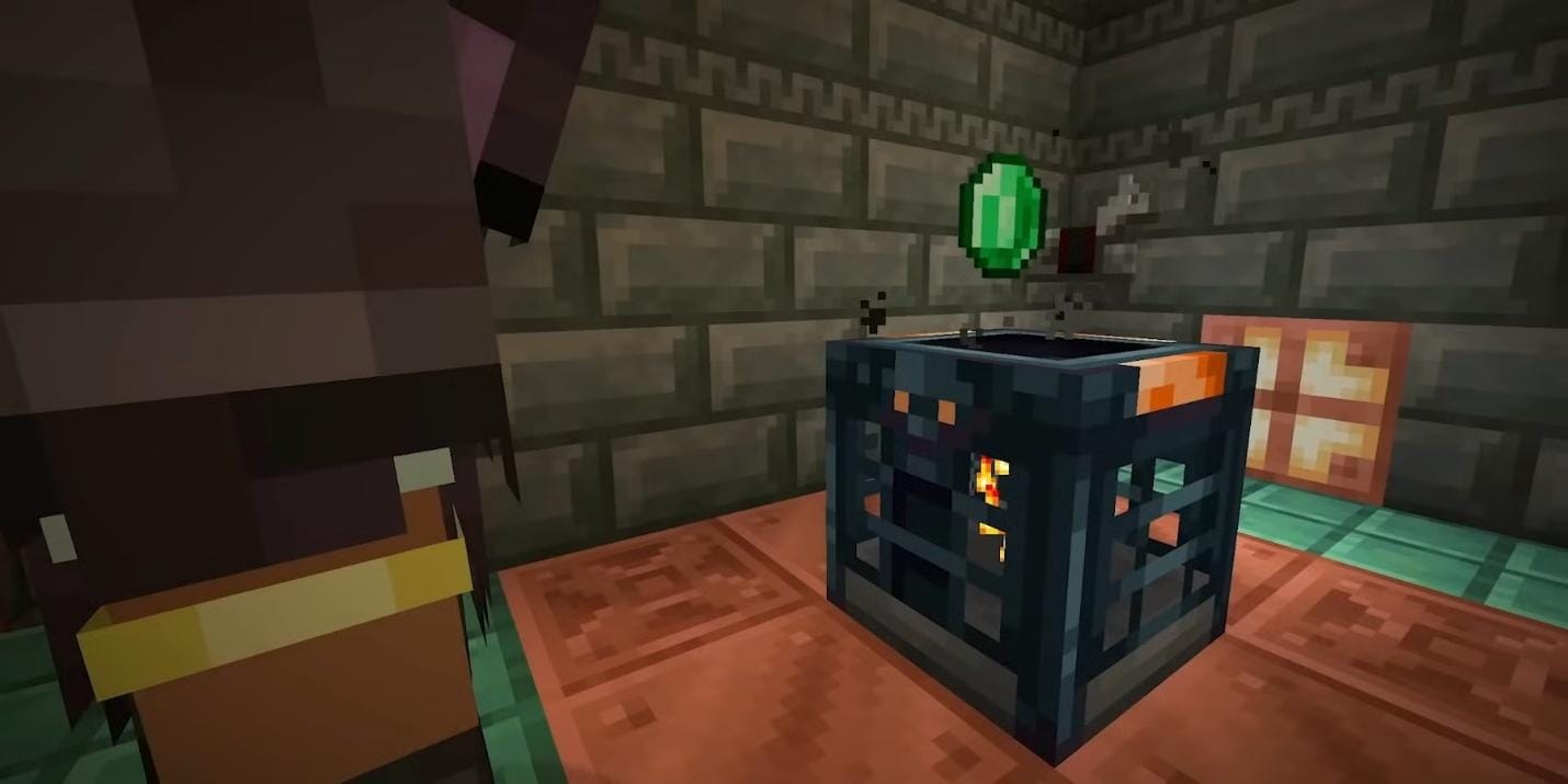 Player standing beside a Trial Chamber vault with an emerald hovering above it in a copper-and-tuff room.