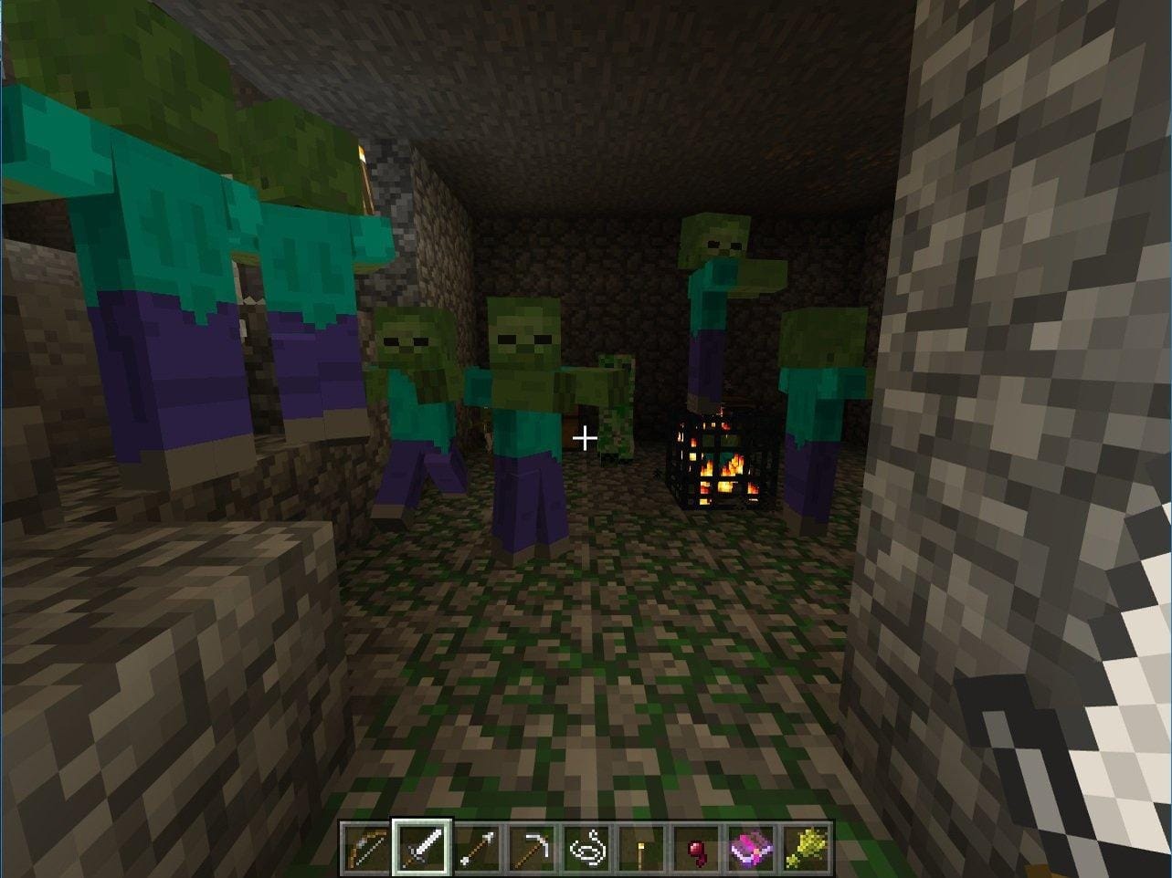 Minecraft dungeon room with a zombie spawner and several zombies gathered around it.