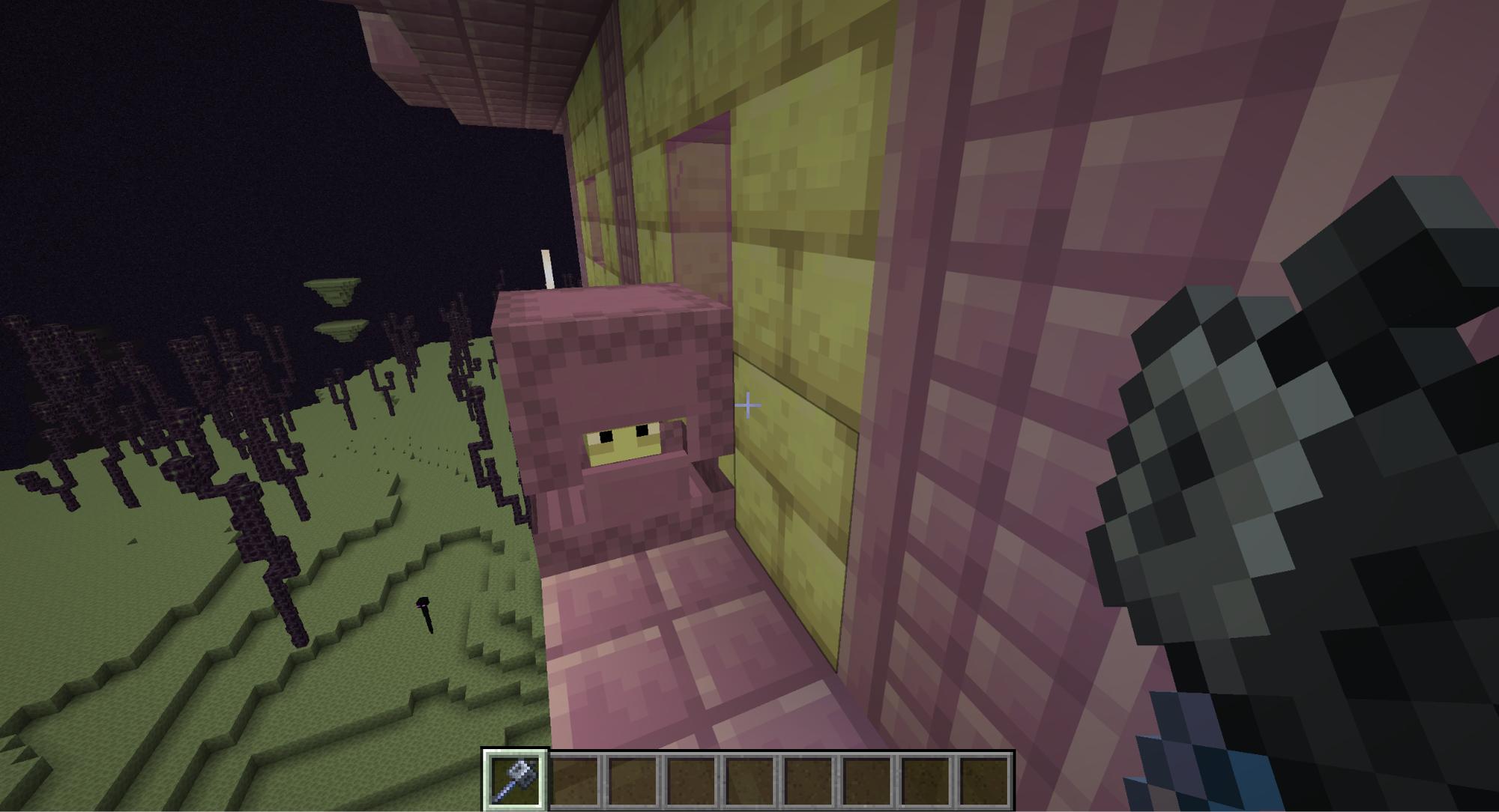 A Minecraft screenshot of the player holding a mace at a Shulker in an End City.