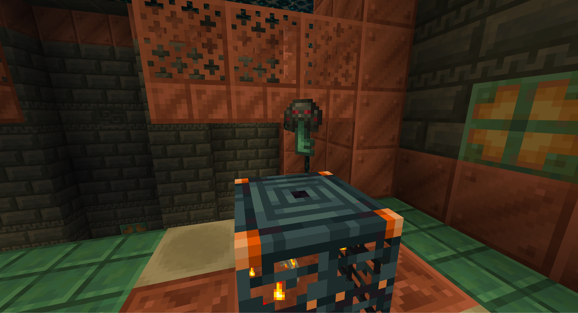 A Minecraft screenshot of an ominous key over a trial spawner.