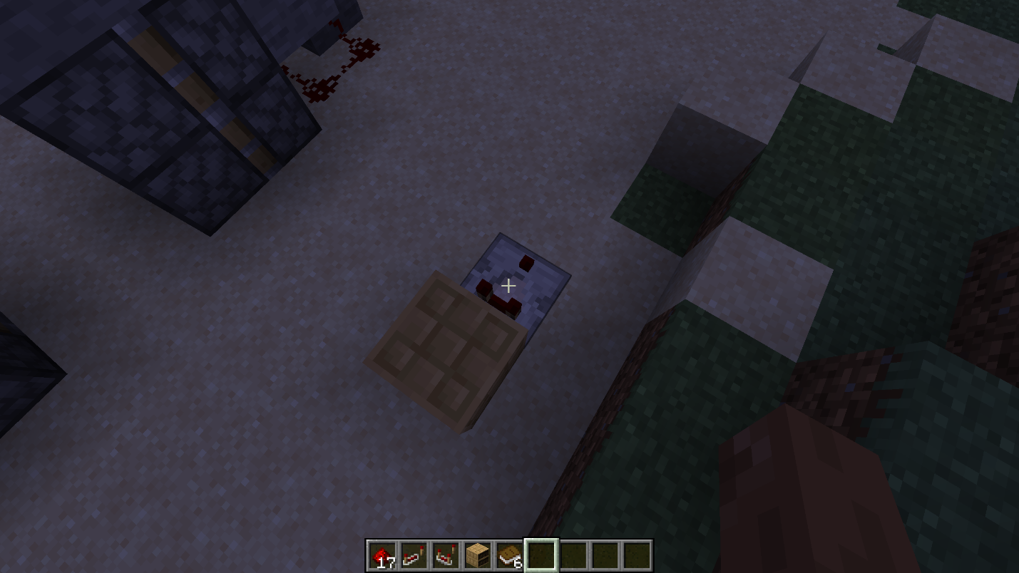 Alt text: Comparator facing outward from a chiseled bookshelf for a hidden Minecraft door trigger.