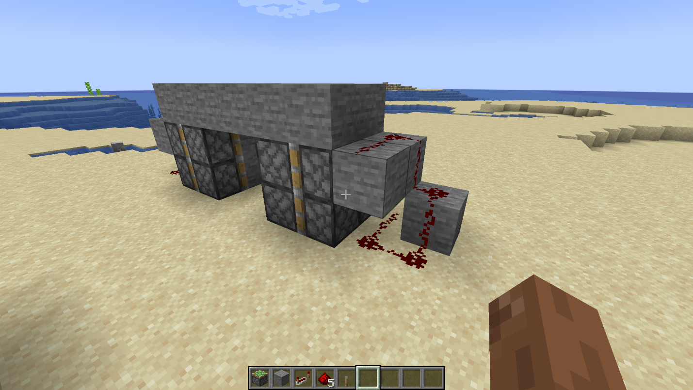 Redstone dust laid around the side blocks and ground of a compact 2x2 hidden piston door.