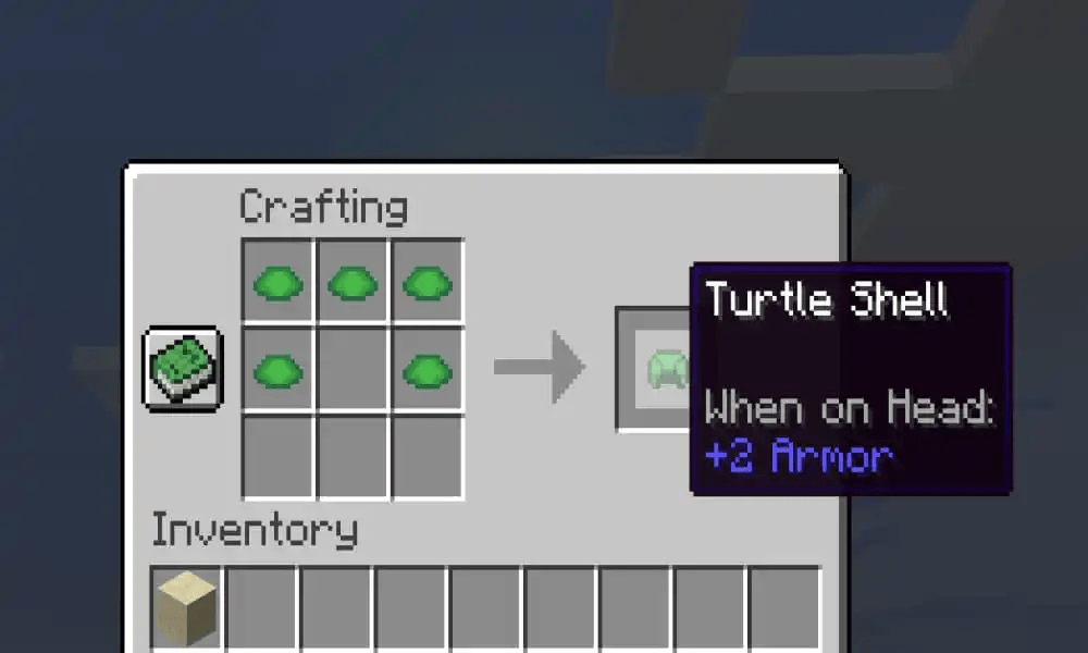 Crafting table recipe for a turtle shell helmet using five turtle scutes, showing the turtle shell item with +2 armor.