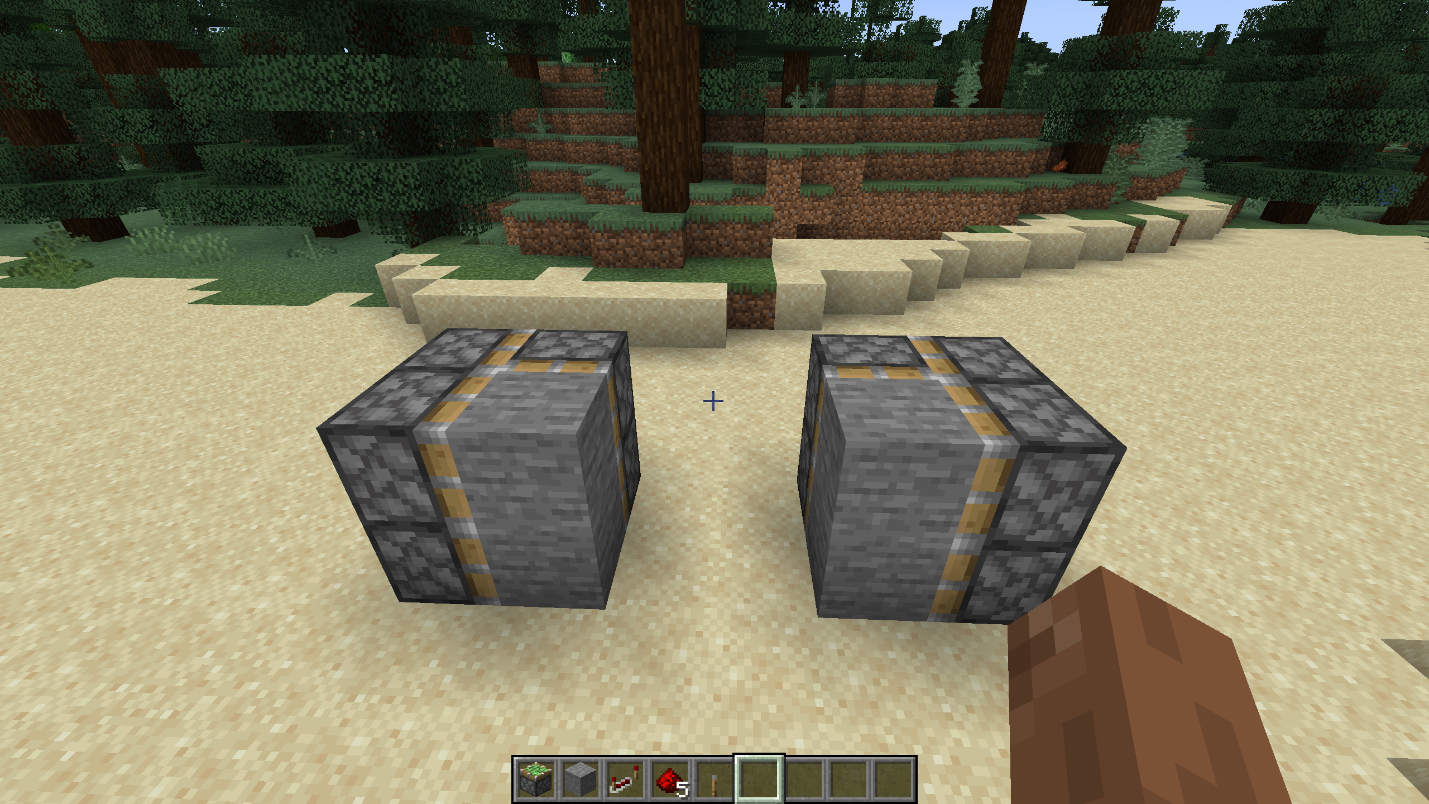 Stone door blocks placed inside mirrored sticky piston groups for a compact 2x2 hidden piston door in Minecraft.
