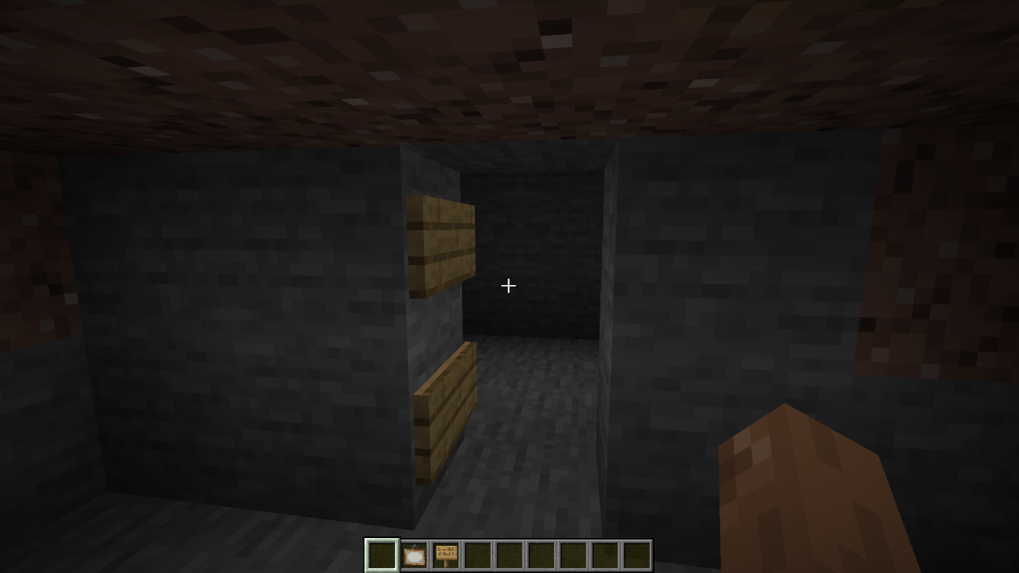Two signs placed inside a 1x2 Minecraft doorway to support a hidden painting entrance.