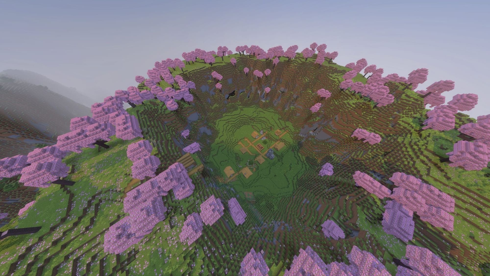 A Minecraft screenshot of a village inside of a ring of cliffs and cherry blossoms.