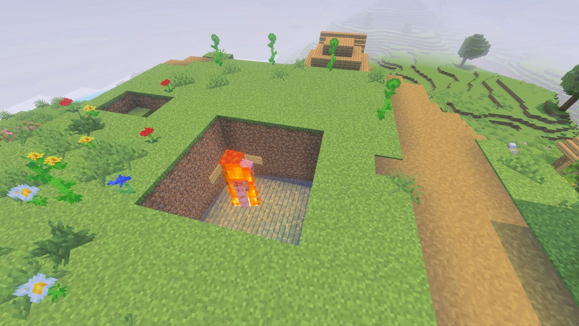 A Minecraft screenshot of an iron golem on fire in a pool of water.