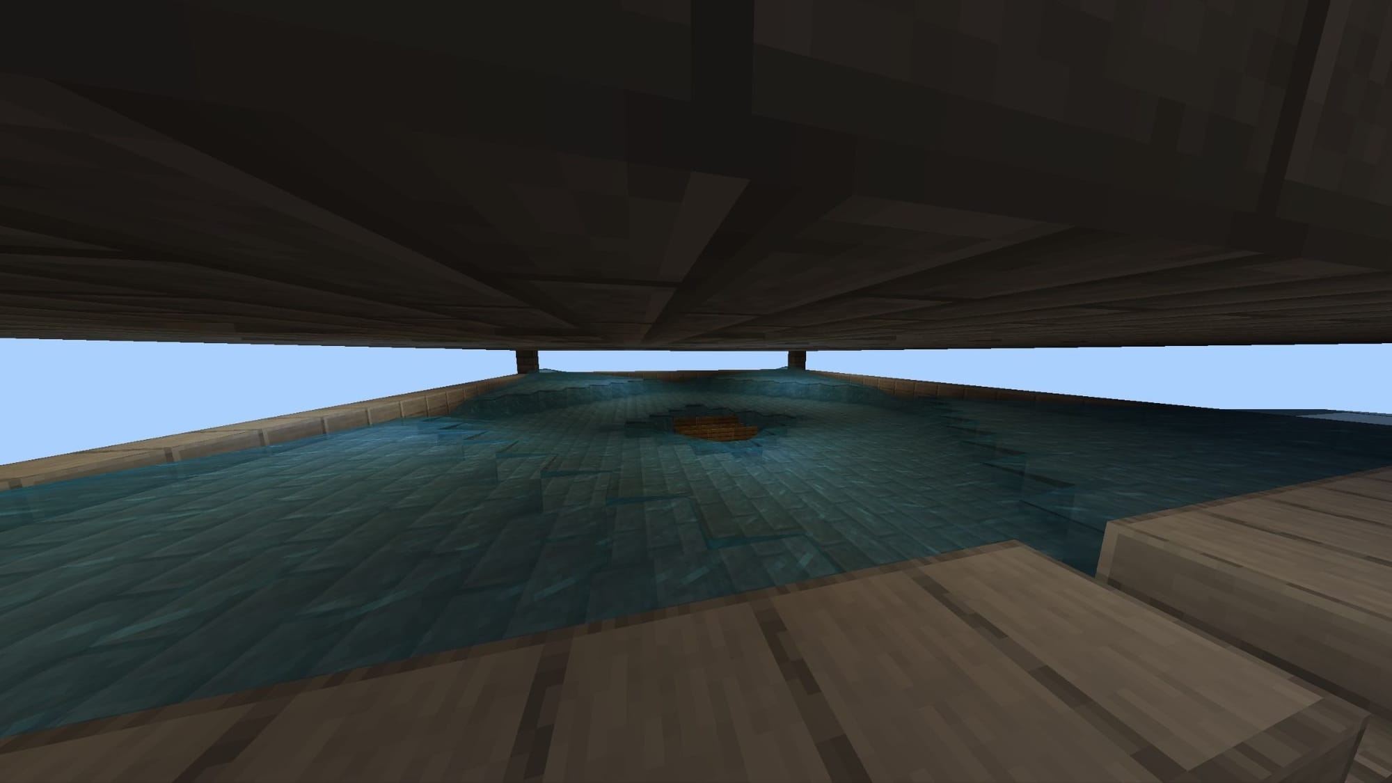 A Minecraft screenshot of a large pool of water flowing to the center.