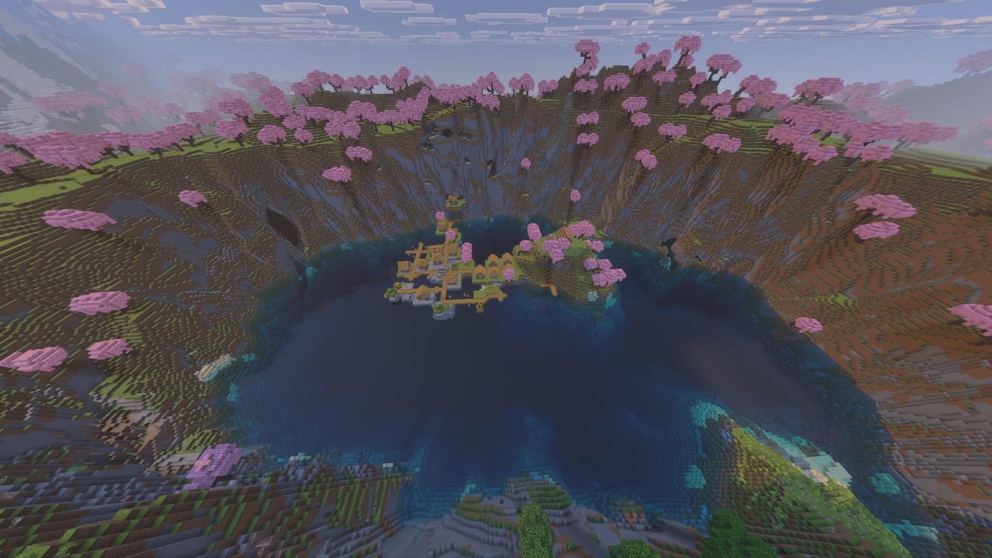 A Minecraft screenshot of a lake inside a cliff drop, a village on the water.