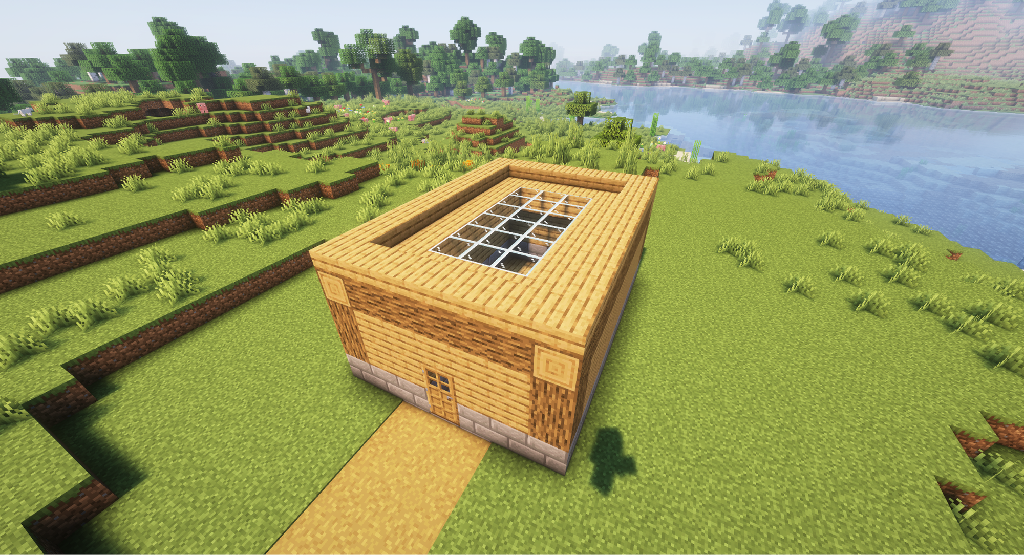 A Minecraft screenshot of a house with a skylight of glass.