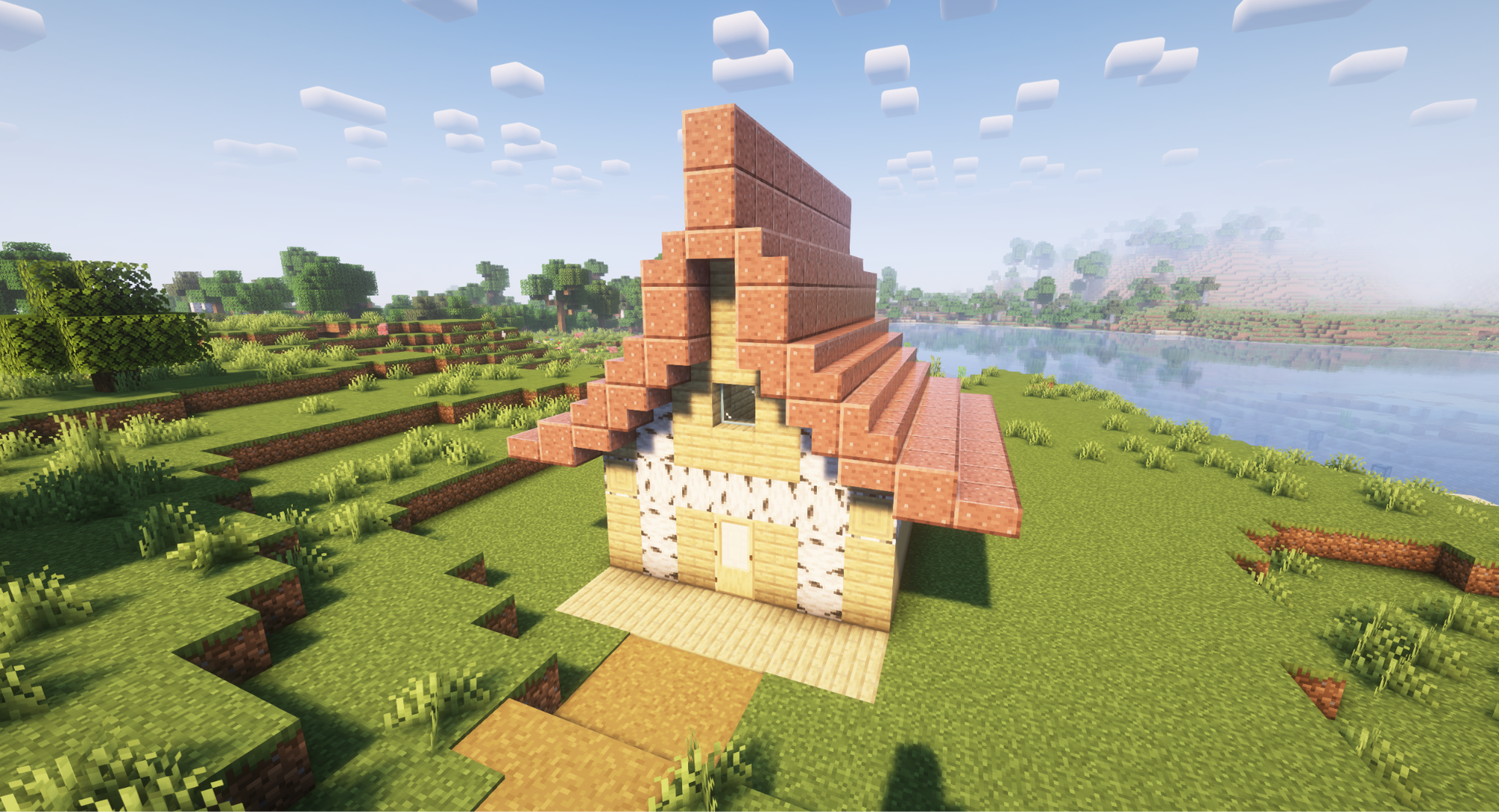 A Minecraft screenshot of a house with a gullwing style house.