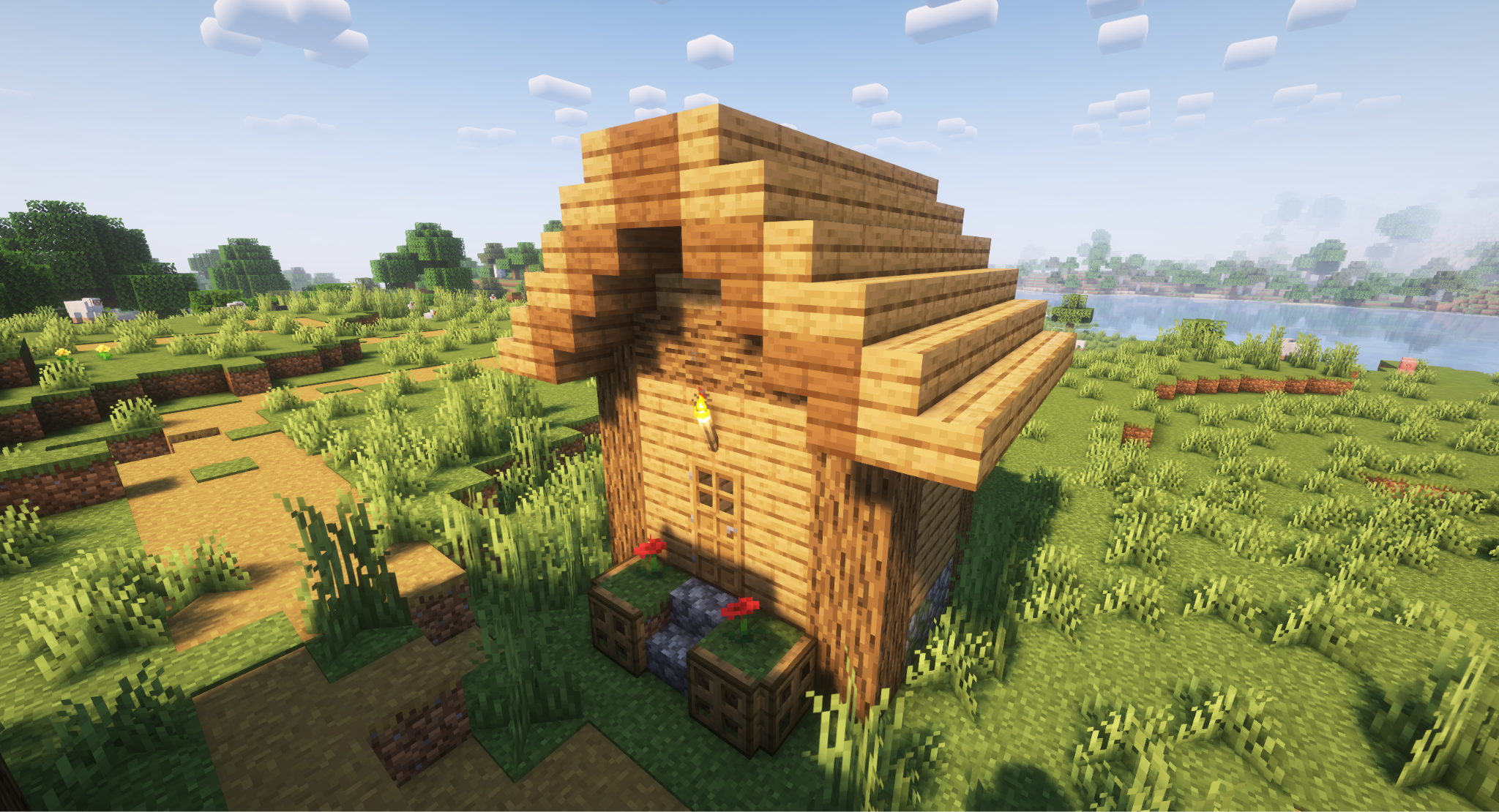 A Minecraft screenshot of a house with a gable roof.