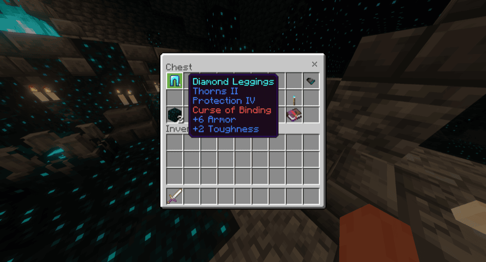 A Minecraft screenshot of diamond leggings with Curse of Binding in a loot chest.
